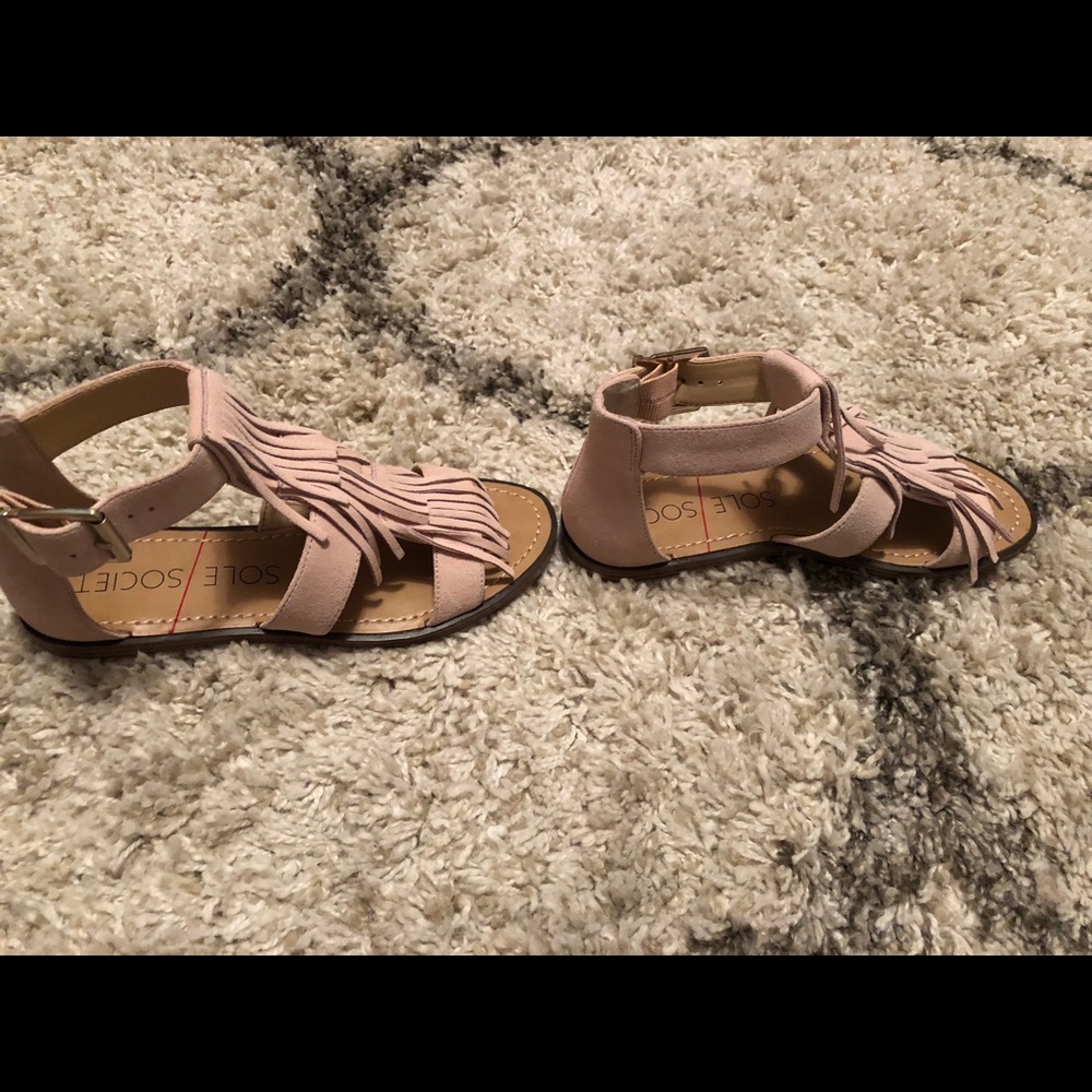 Blush colored sandals with fringes.  Never worn.